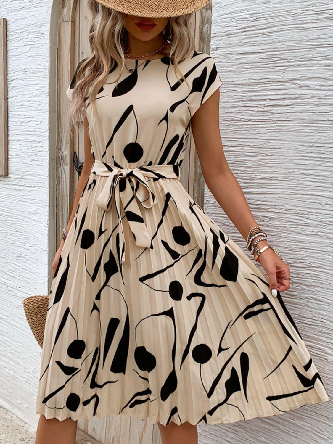 Get trendy with Tied Pleated Printed Cap Sleeve Dress - Dress available at Styles Code. Grab yours today!