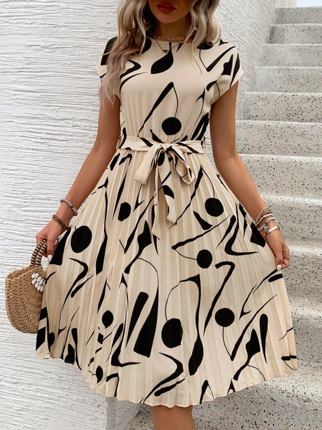 Get trendy with Tied Pleated Printed Cap Sleeve Dress - Dress available at Styles Code. Grab yours today!
