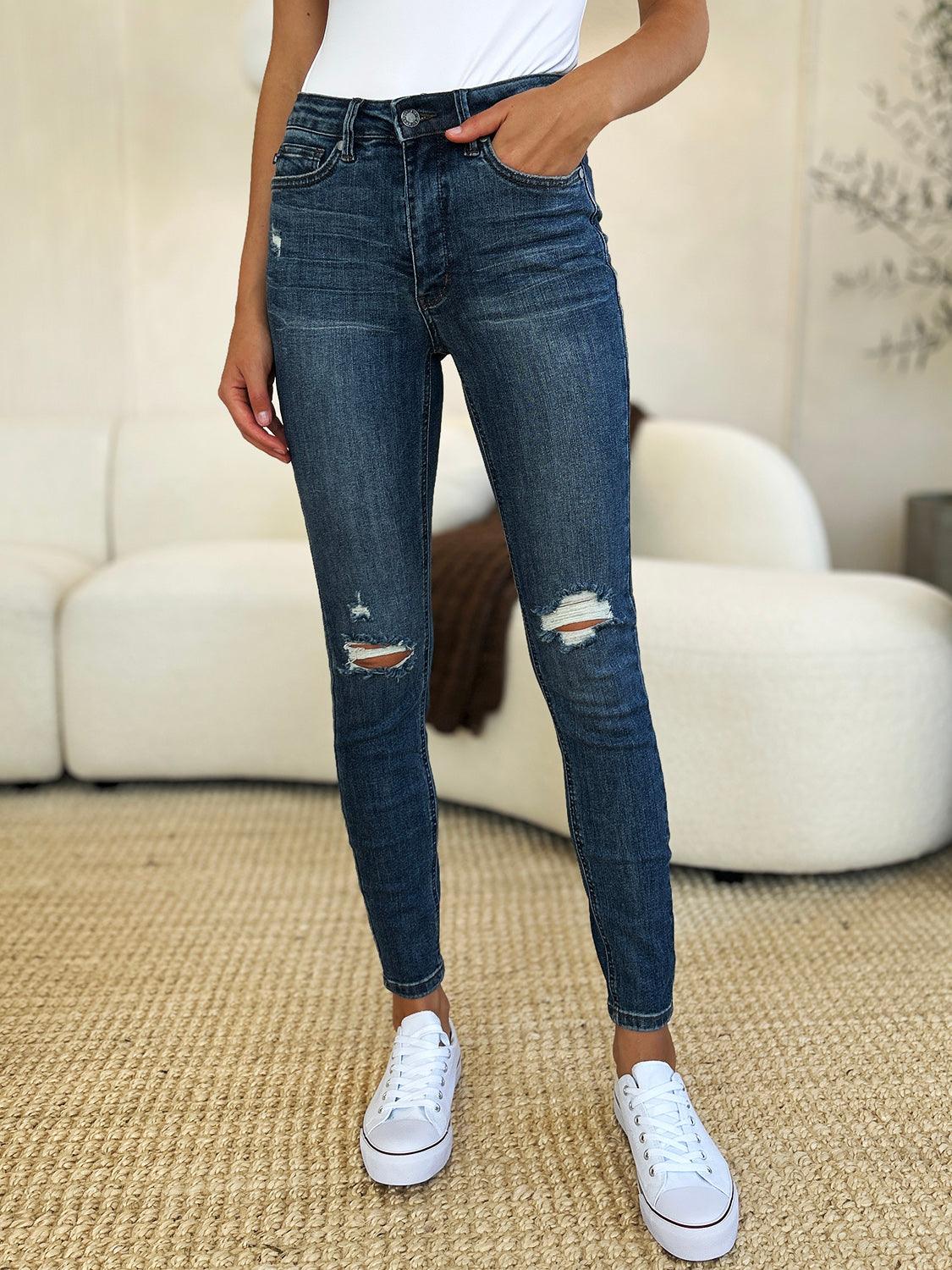 Get trendy with Full Size Mid Waist Distressed Slim Jeans - Plus Size available at Styles Code. Grab yours today!