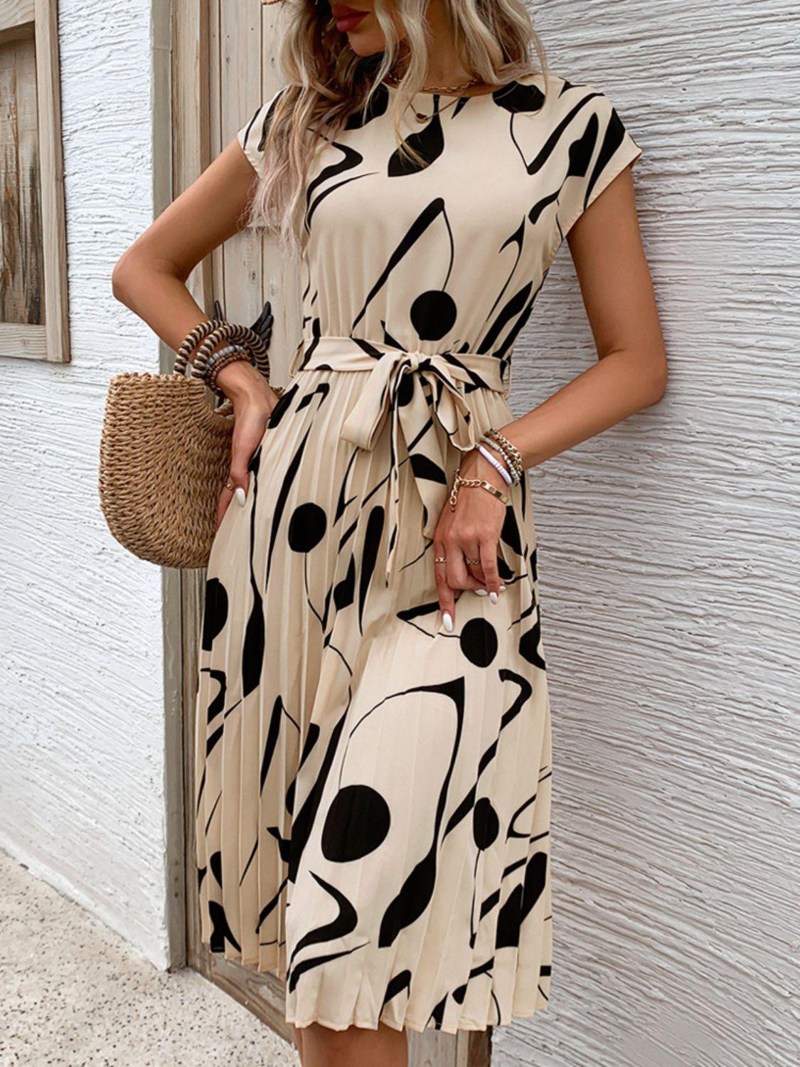 Get trendy with Tied Pleated Printed Cap Sleeve Dress - Dress available at Styles Code. Grab yours today!