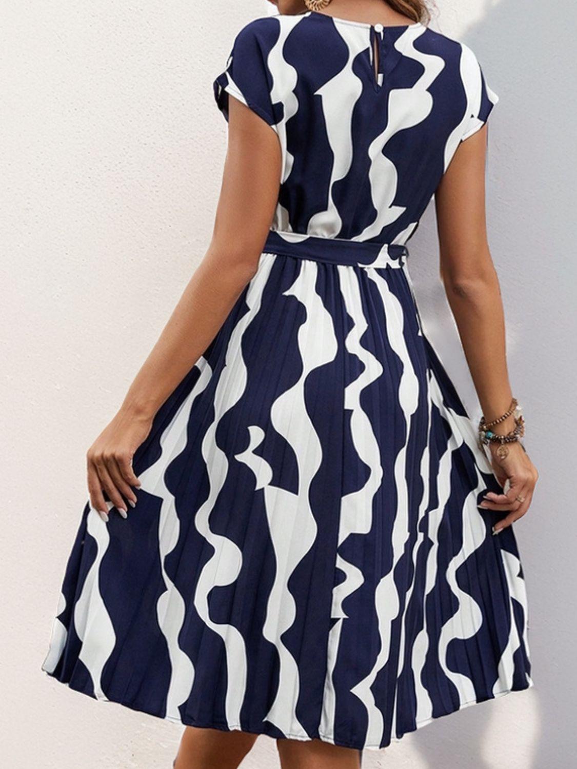 Get trendy with Tied Pleated Printed Cap Sleeve Dress - Dress available at Styles Code. Grab yours today!