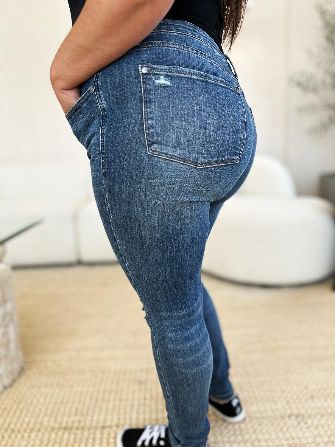 Get trendy with Full Size Mid Waist Distressed Slim Jeans - Plus Size available at Styles Code. Grab yours today!