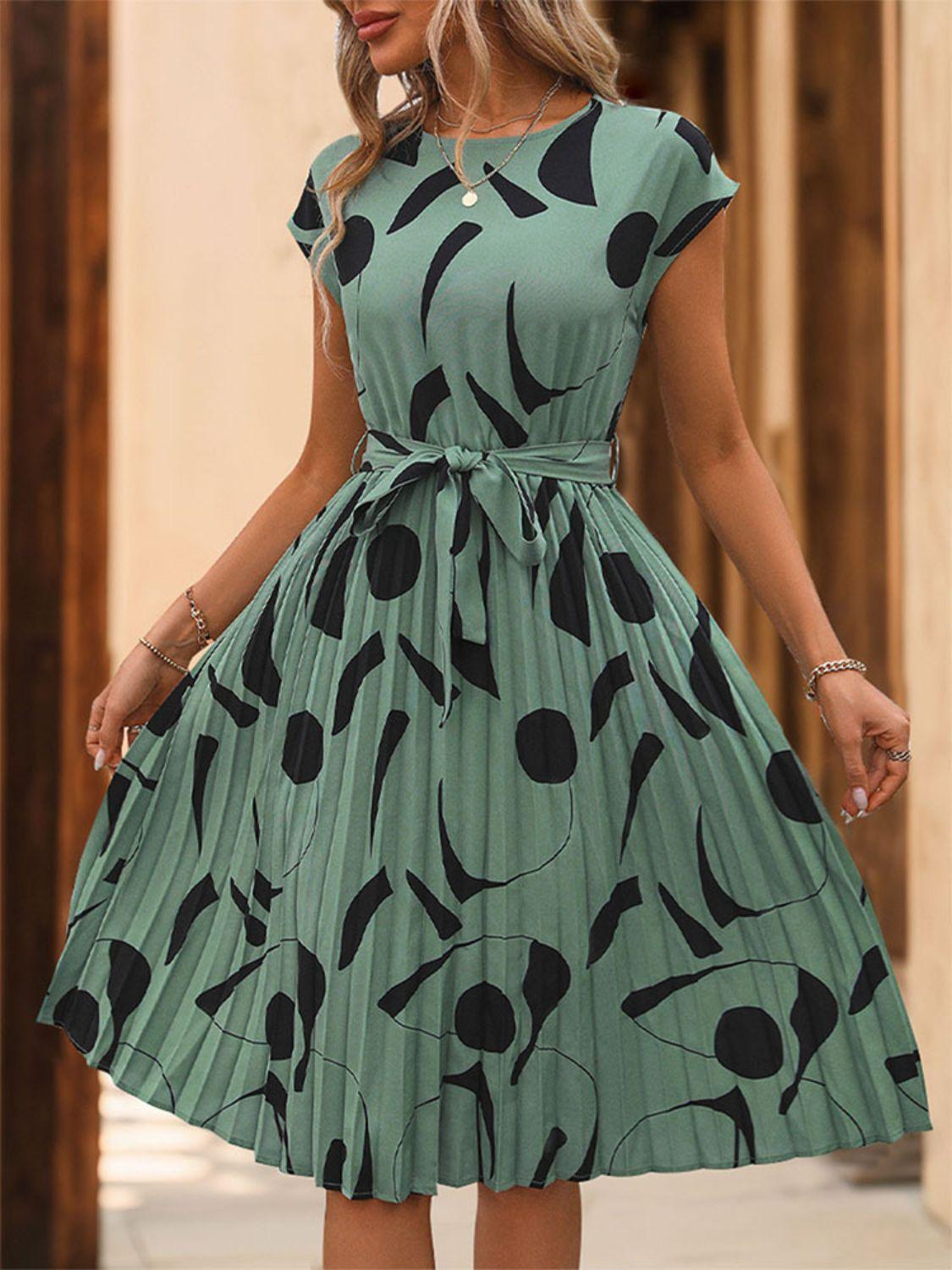 Get trendy with Tied Pleated Printed Cap Sleeve Dress - Dress available at Styles Code. Grab yours today!
