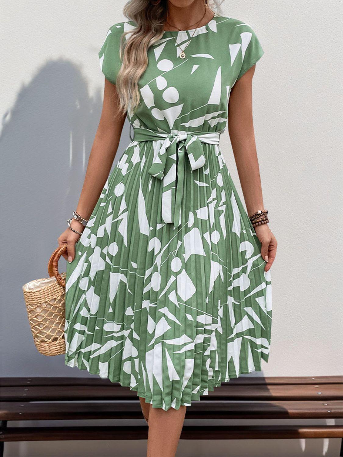 Get trendy with Tied Pleated Printed Cap Sleeve Dress - Dress available at Styles Code. Grab yours today!