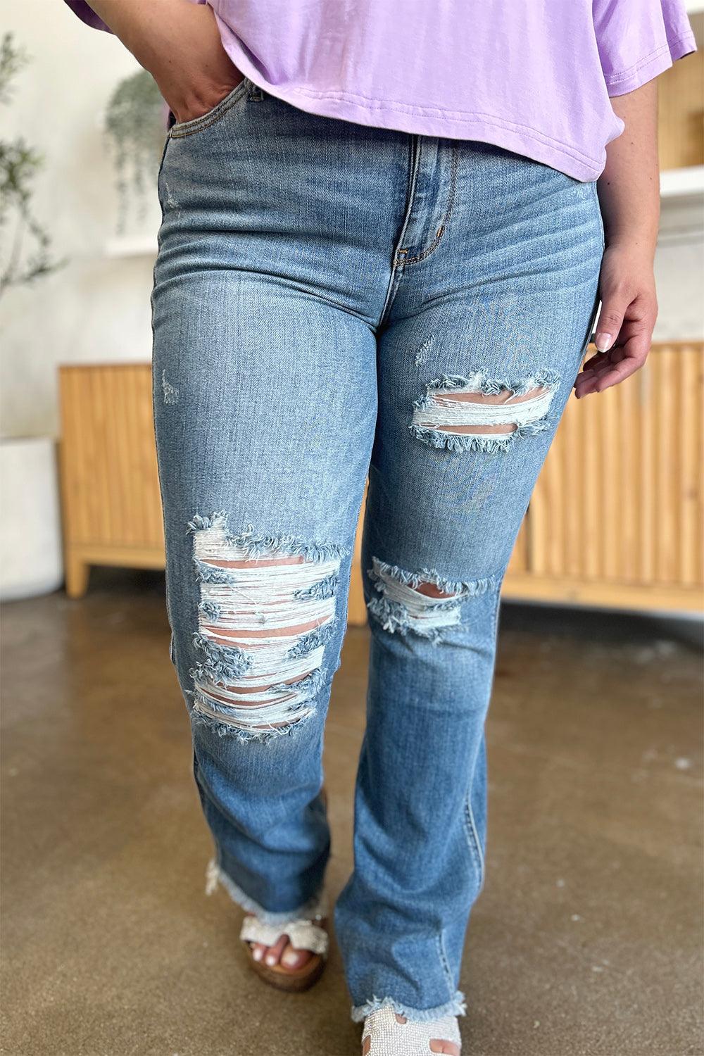 Get trendy with Full Size Distressed Raw Hem Bootcut Jeans - Plus Size available at Styles Code. Grab yours today!