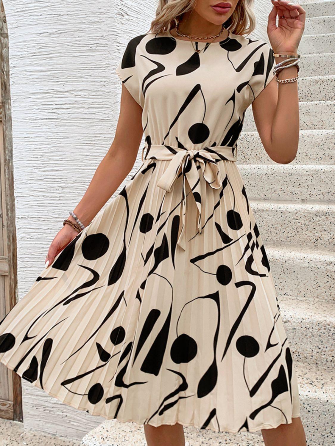 Get trendy with Tied Pleated Printed Cap Sleeve Dress - Dress available at Styles Code. Grab yours today!