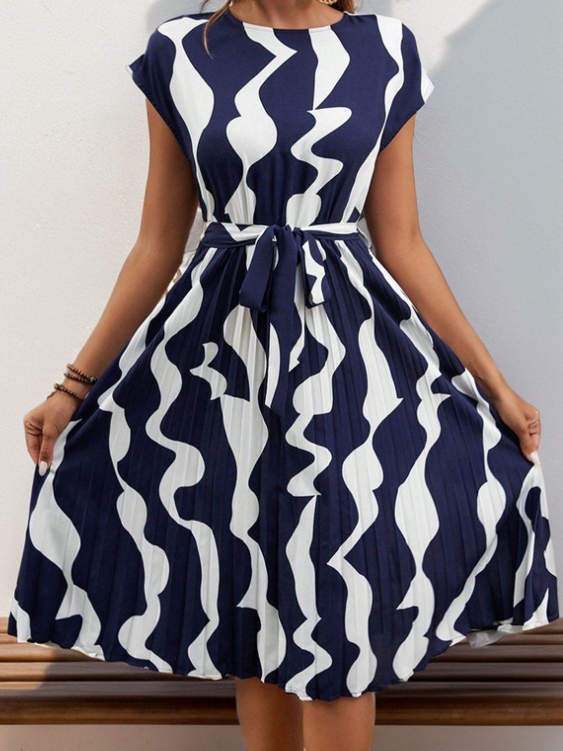 Get trendy with Tied Pleated Printed Cap Sleeve Dress - Dress available at Styles Code. Grab yours today!