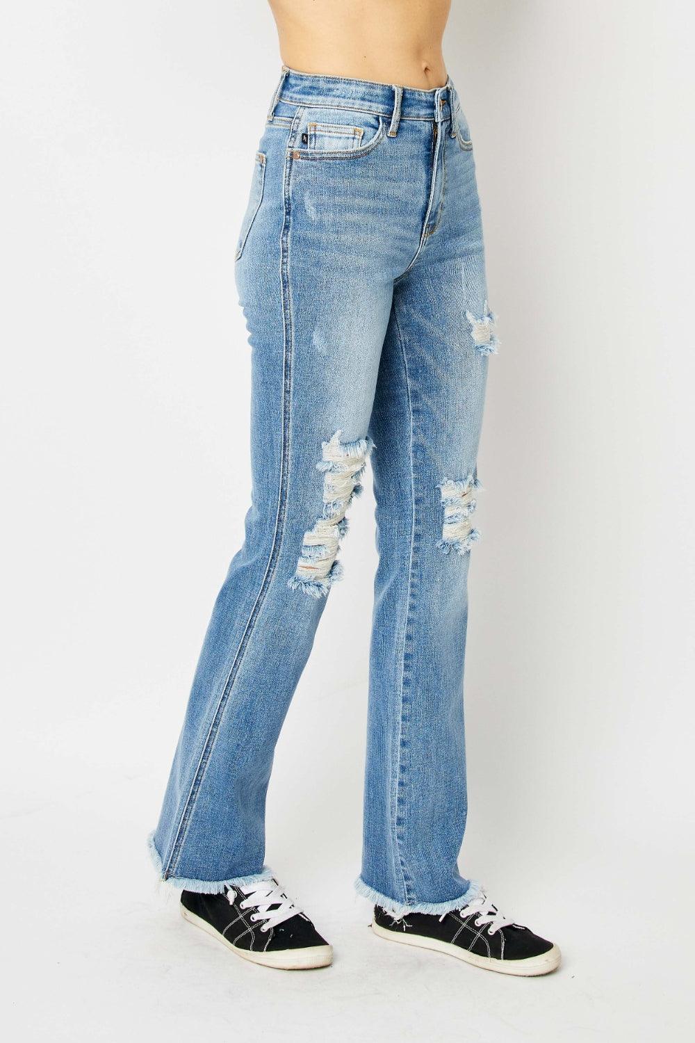 Get trendy with Full Size Distressed Raw Hem Bootcut Jeans - Plus Size available at Styles Code. Grab yours today!