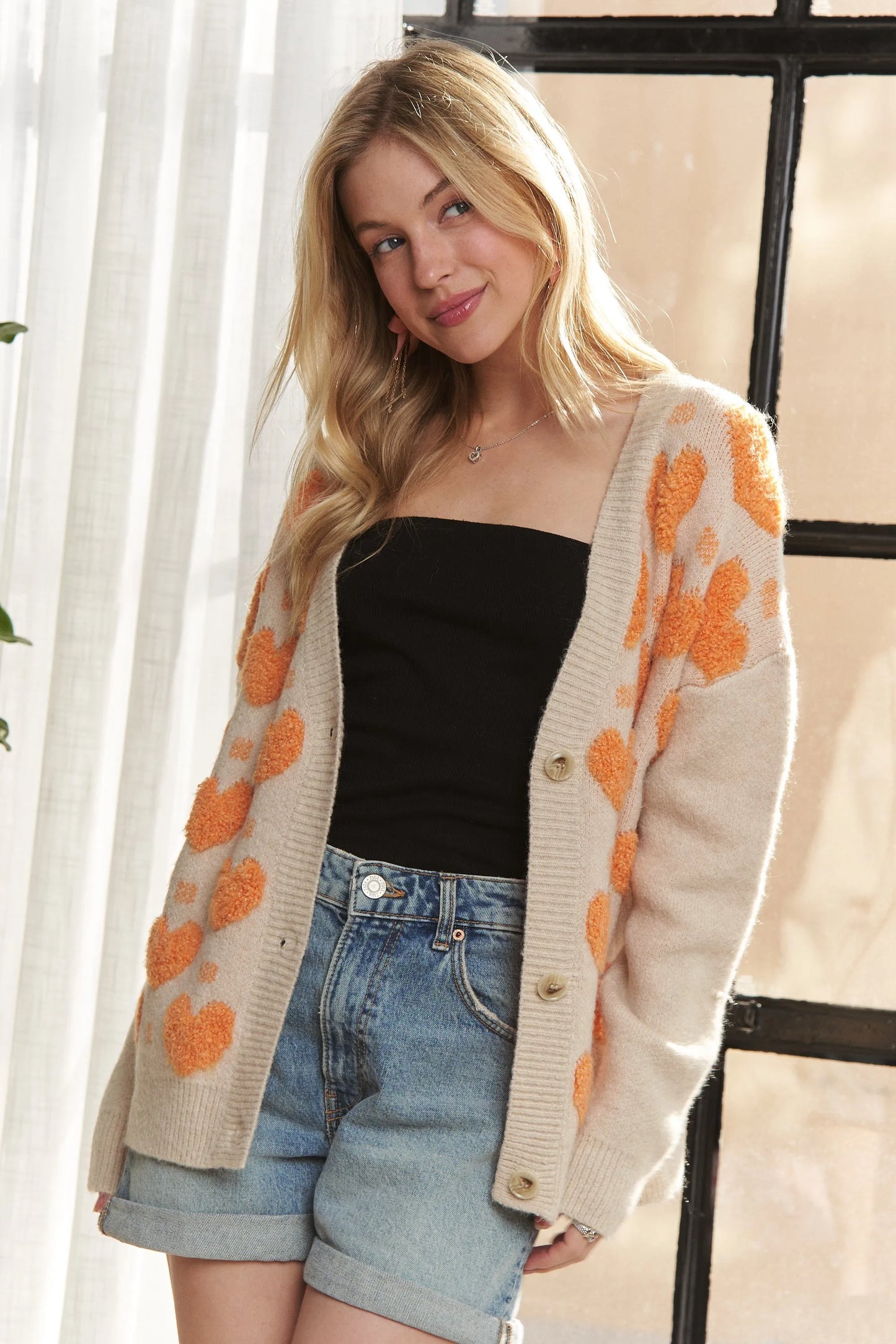 Get trendy with Button Down Heart Cardigan - available at Styles Code. Grab yours today!