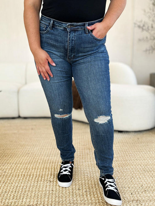 Get trendy with Full Size Mid Waist Distressed Slim Jeans - Plus Size available at Styles Code. Grab yours today!