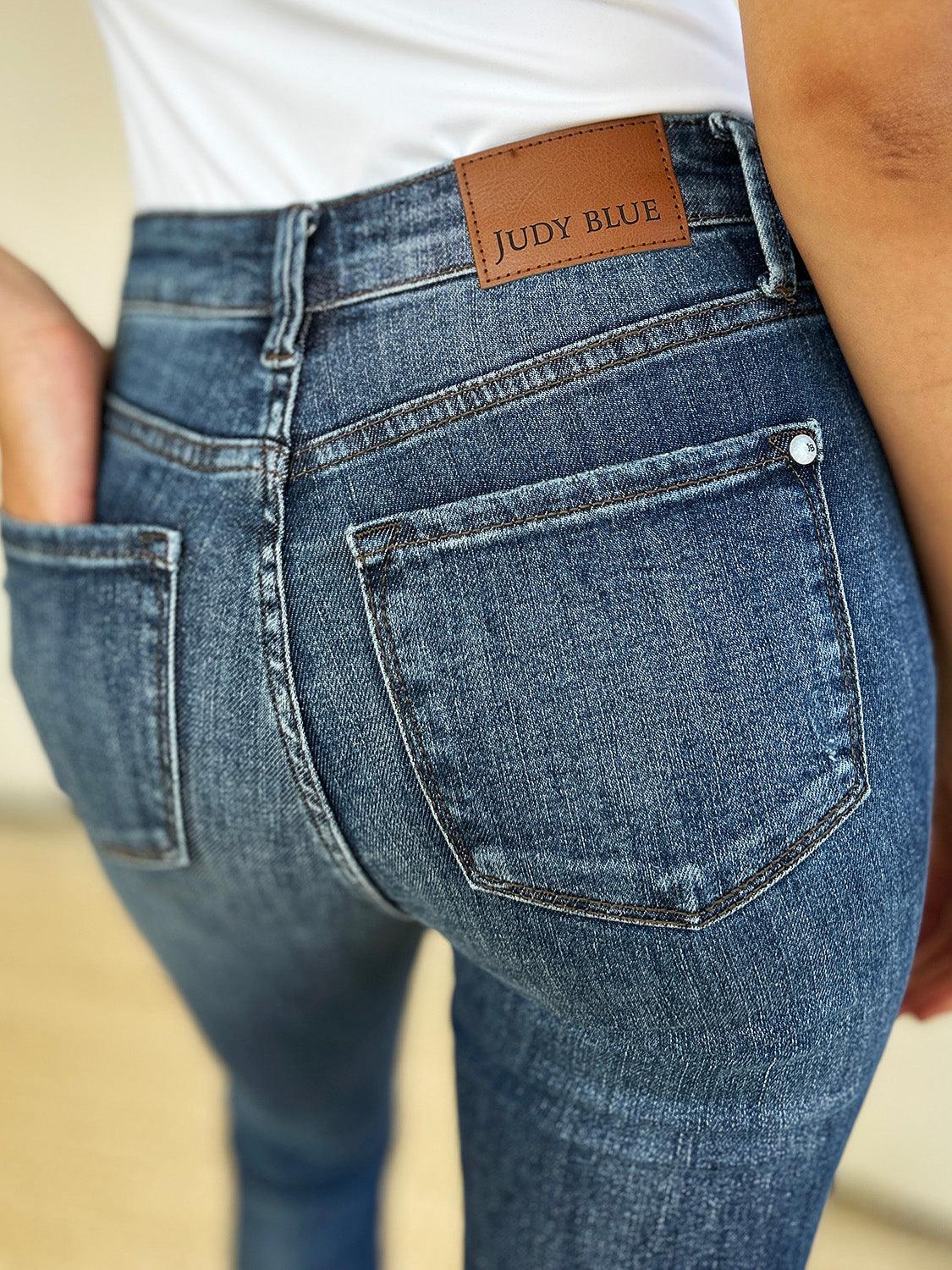 Get trendy with Full Size Mid Waist Distressed Slim Jeans - Plus Size available at Styles Code. Grab yours today!