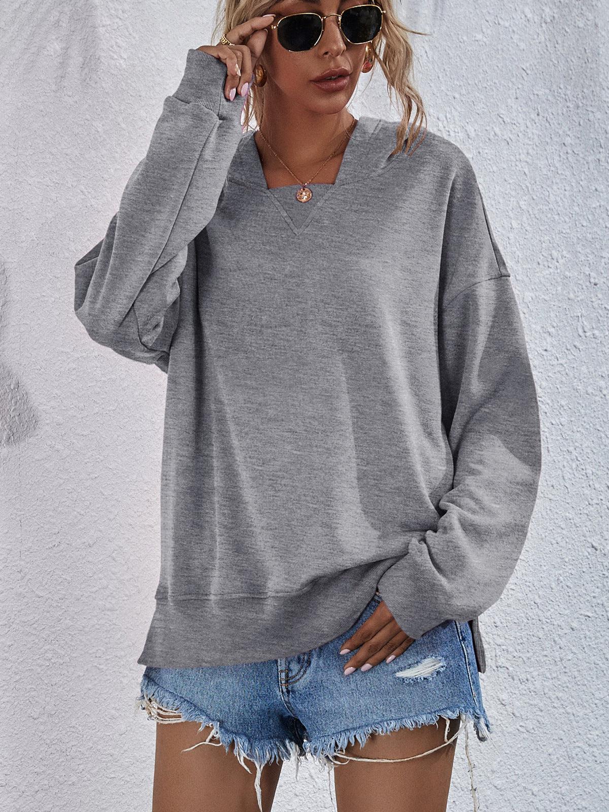 Get trendy with Dropped Shoulder Slit Hoodie - Tops available at Styles Code. Grab yours today!