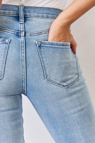 Get trendy with Full Size Mid Rise Slit Bootcut Jeans - available at Styles Code. Grab yours today!