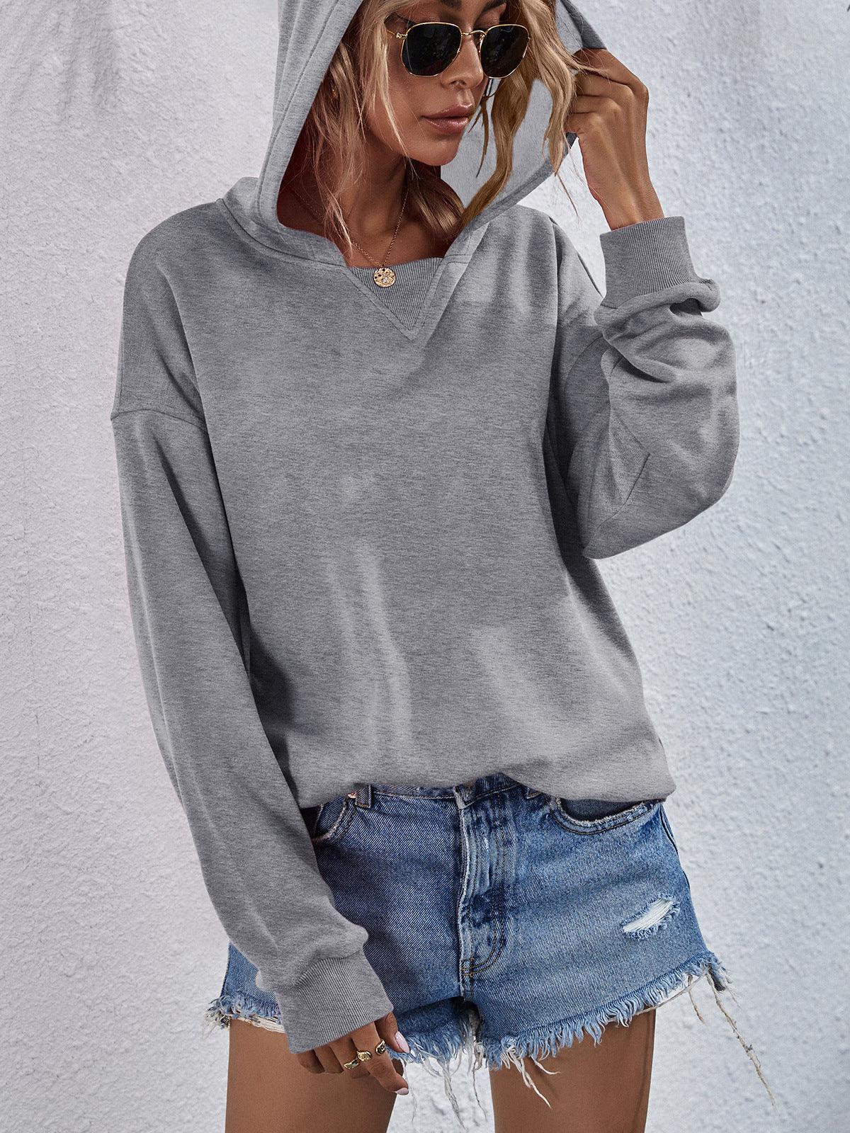 Get trendy with Dropped Shoulder Slit Hoodie - Tops available at Styles Code. Grab yours today!