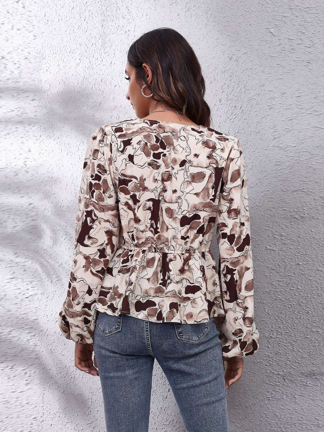 Get trendy with Ruched Printed V-Neck Long Sleeve Blouse - Blouse available at Styles Code. Grab yours today!