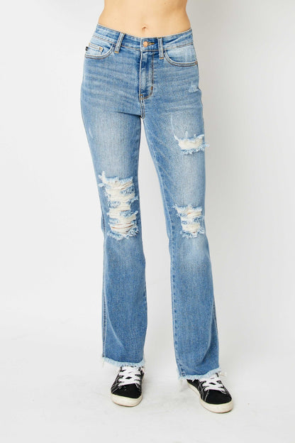 Get trendy with Judy Blue Full Size Distressed Raw Hem Bootcut Jeans - Plus Size available at Styles Code. Grab yours today!