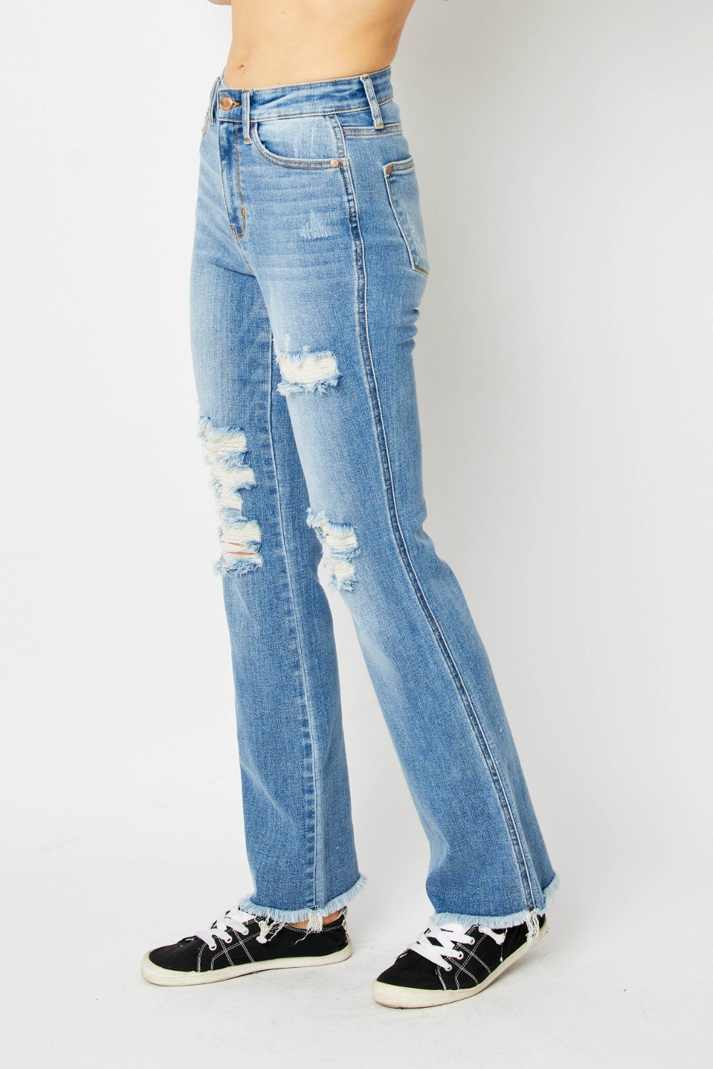 Get trendy with Judy Blue Full Size Distressed Raw Hem Bootcut Jeans - Plus Size available at Styles Code. Grab yours today!