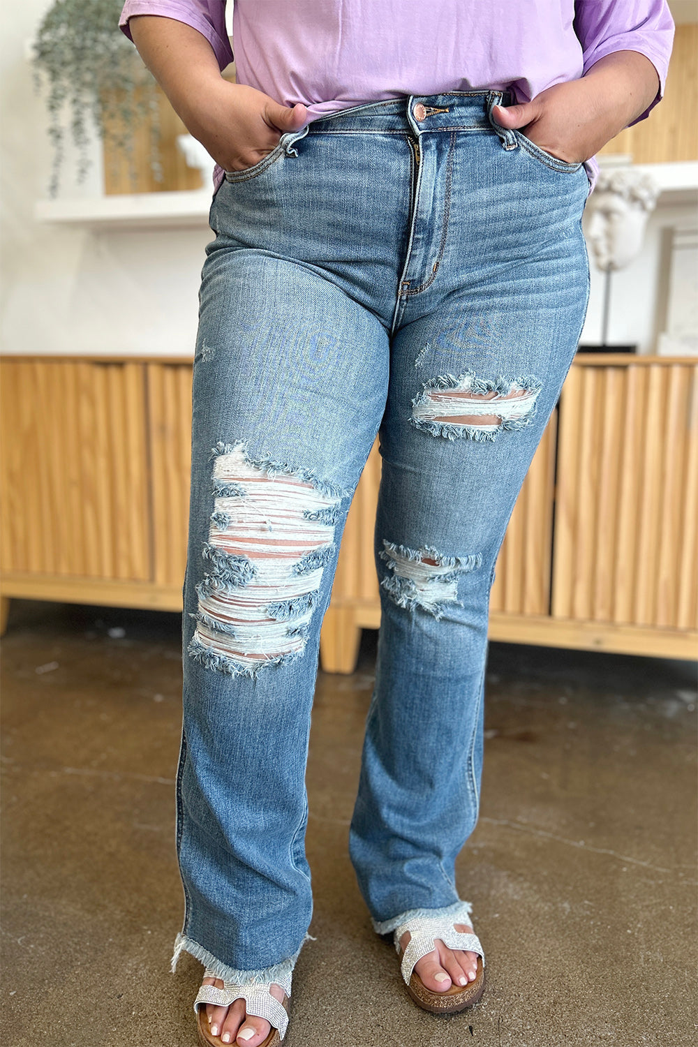 Get trendy with Judy Blue Full Size Distressed Raw Hem Bootcut Jeans - Plus Size available at Styles Code. Grab yours today!