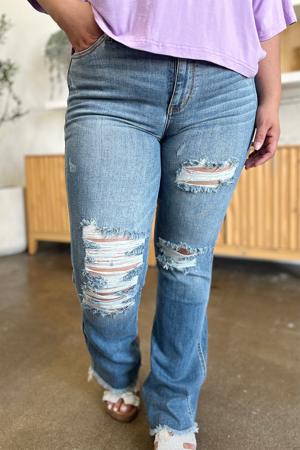 Get trendy with Judy Blue Full Size Distressed Raw Hem Bootcut Jeans - Plus Size available at Styles Code. Grab yours today!