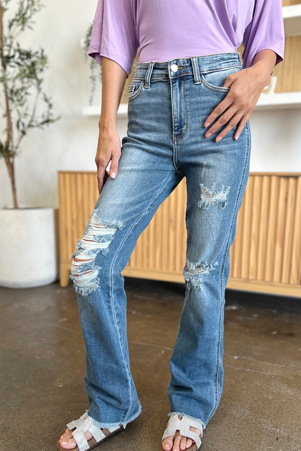 Get trendy with Judy Blue Full Size Distressed Raw Hem Bootcut Jeans - Plus Size available at Styles Code. Grab yours today!