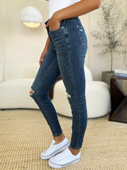 Get trendy with Judy Blue Full Size Mid Waist Distressed Slim Jeans - Plus Size available at Styles Code. Grab yours today!