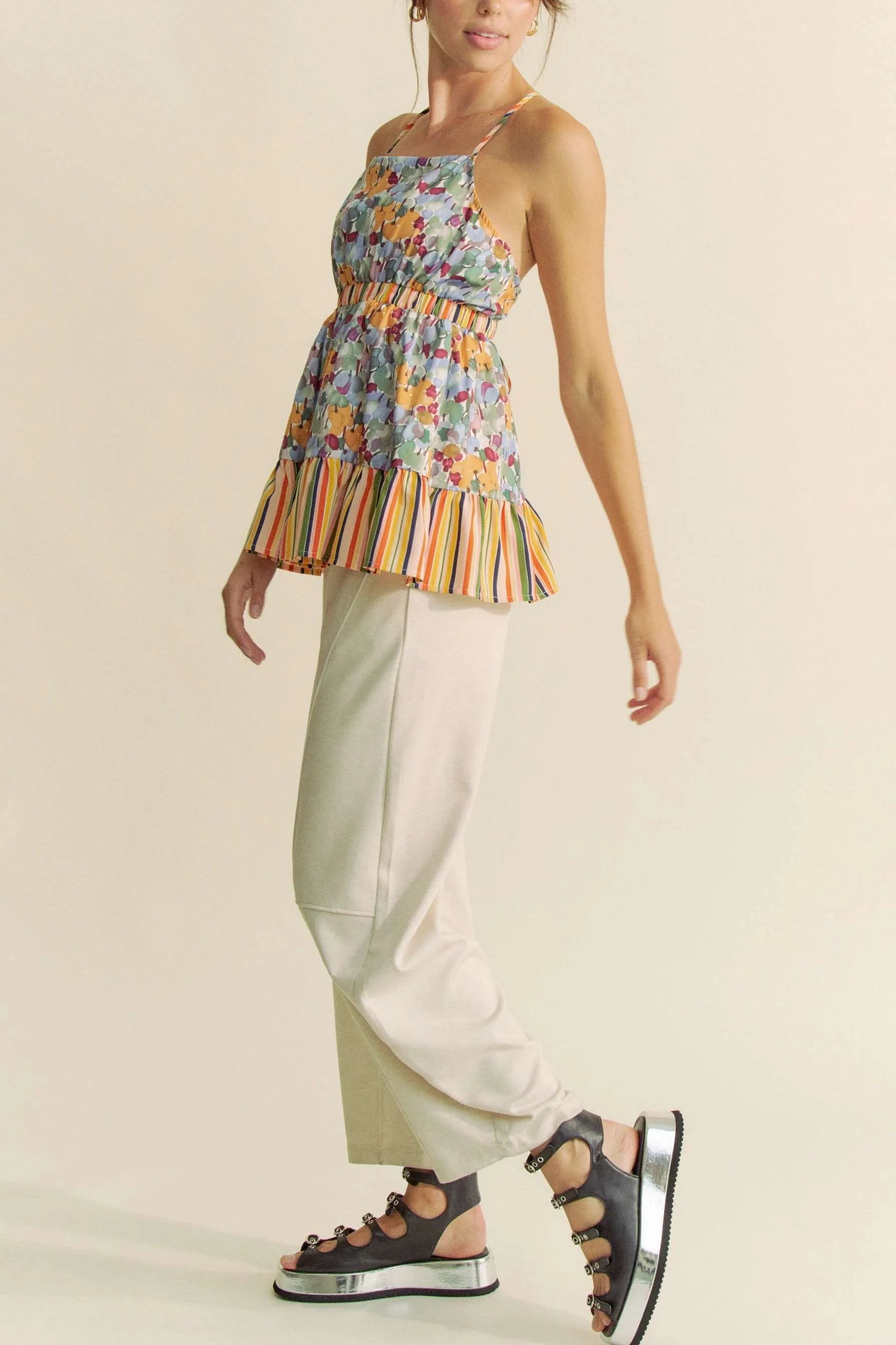 Get trendy with Floral Sleeveless Ruffle Top - Top available at Styles Code. Grab yours today!