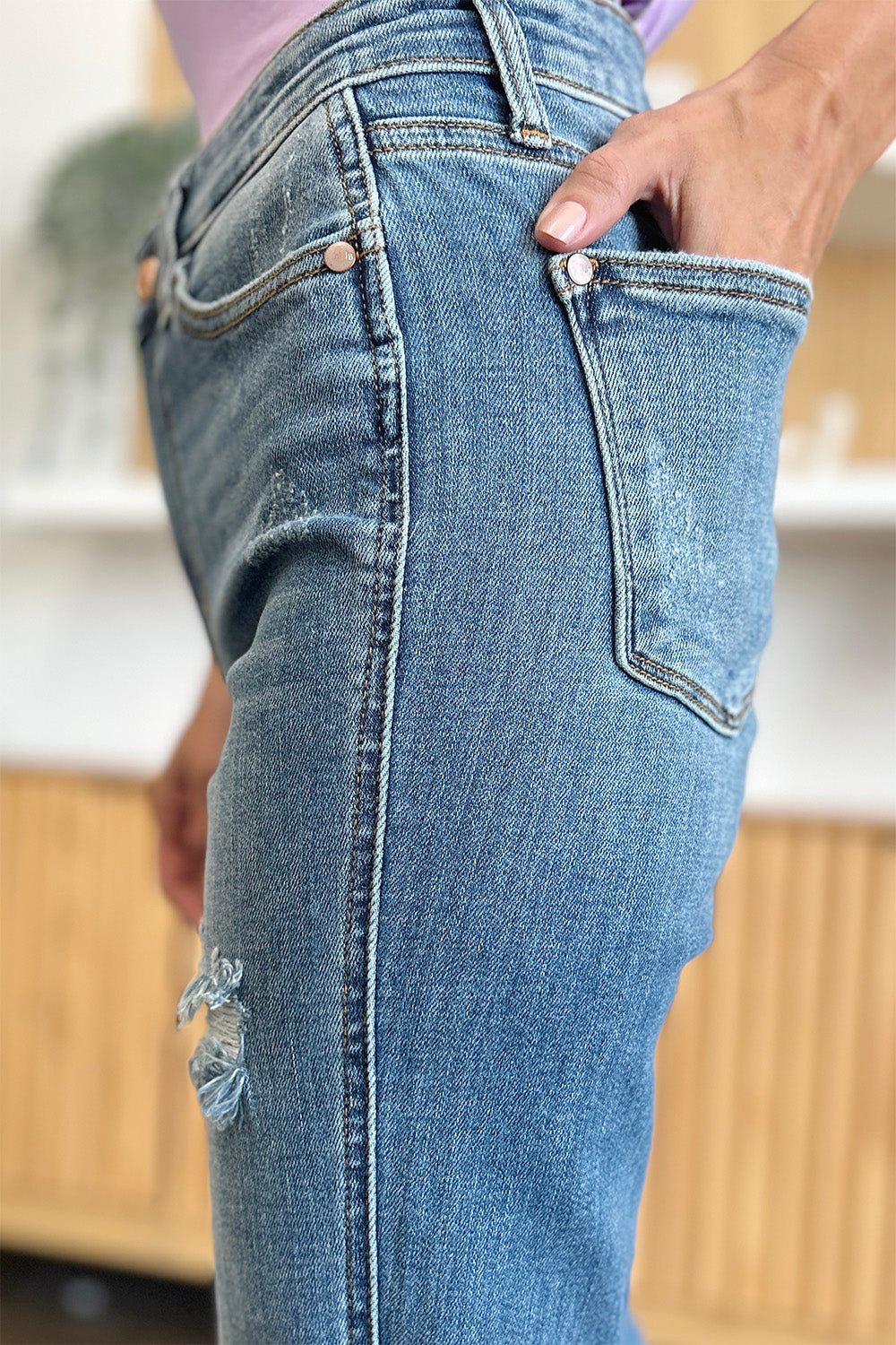 Get trendy with Judy Blue Full Size Distressed Raw Hem Bootcut Jeans - Plus Size available at Styles Code. Grab yours today!