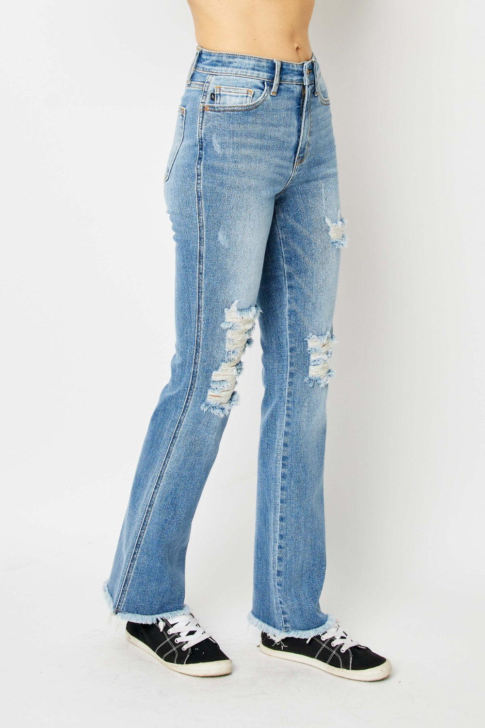 Get trendy with Judy Blue Full Size Distressed Raw Hem Bootcut Jeans - Plus Size available at Styles Code. Grab yours today!