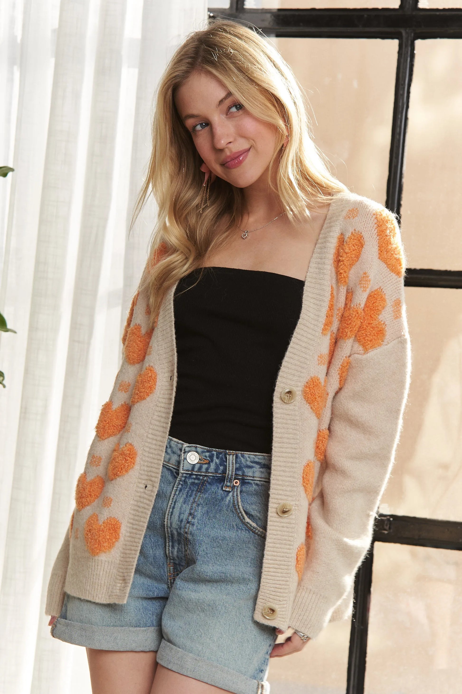Get trendy with Button Down Heart Cardigan -  available at Styles Code. Grab yours today!