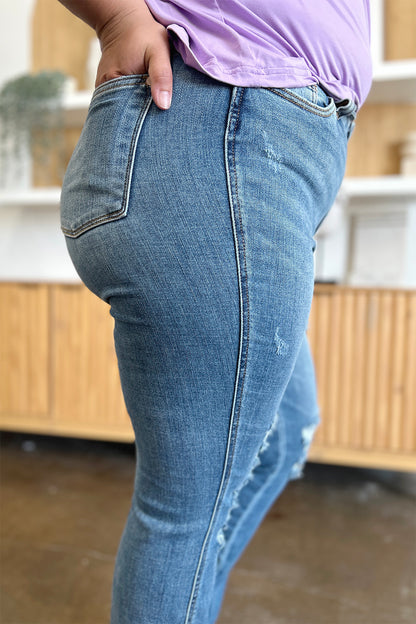 Get trendy with Judy Blue Full Size Distressed Raw Hem Bootcut Jeans - Plus Size available at Styles Code. Grab yours today!