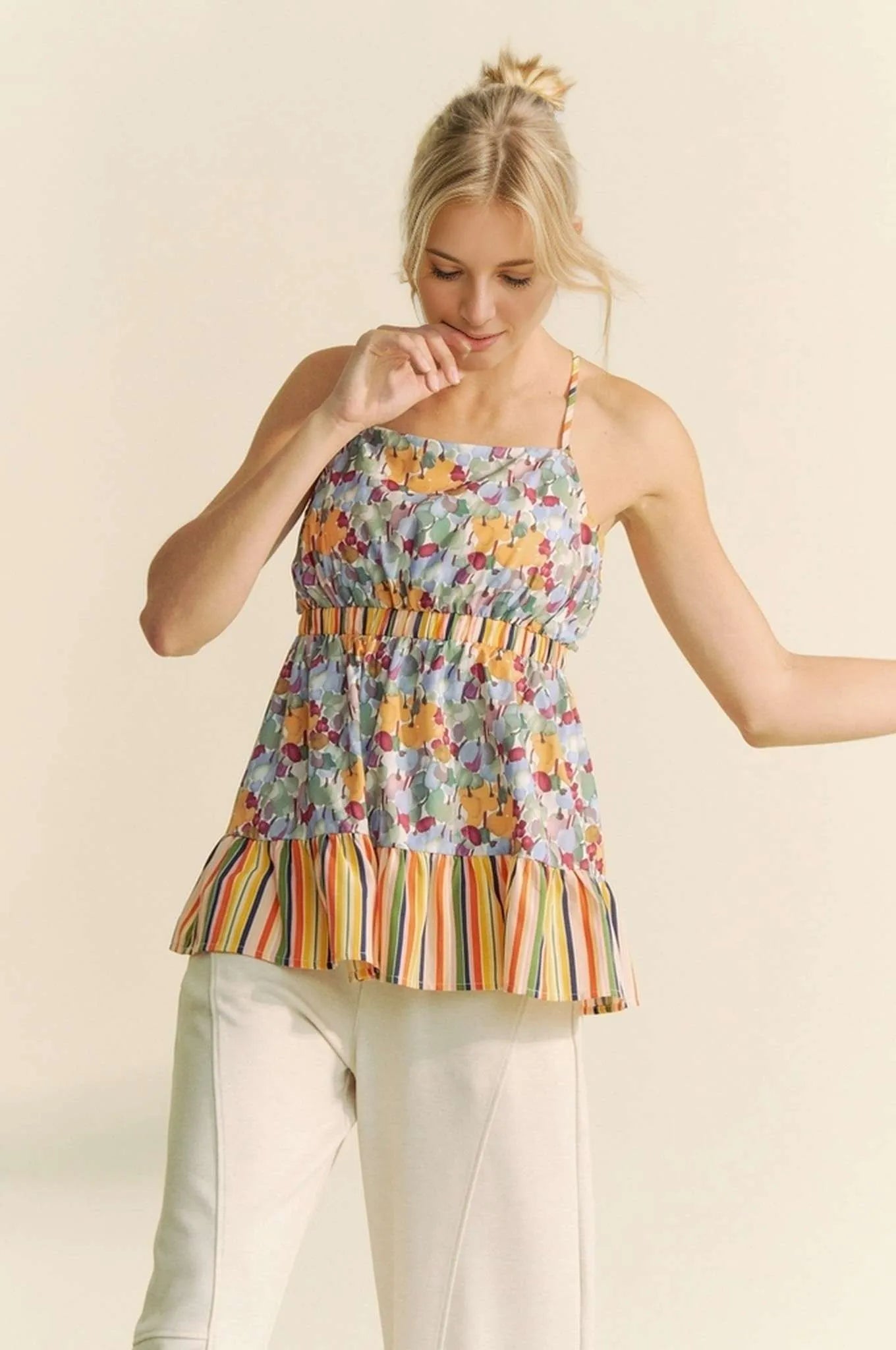 Get trendy with Floral Sleeveless Ruffle Top - Top available at Styles Code. Grab yours today!