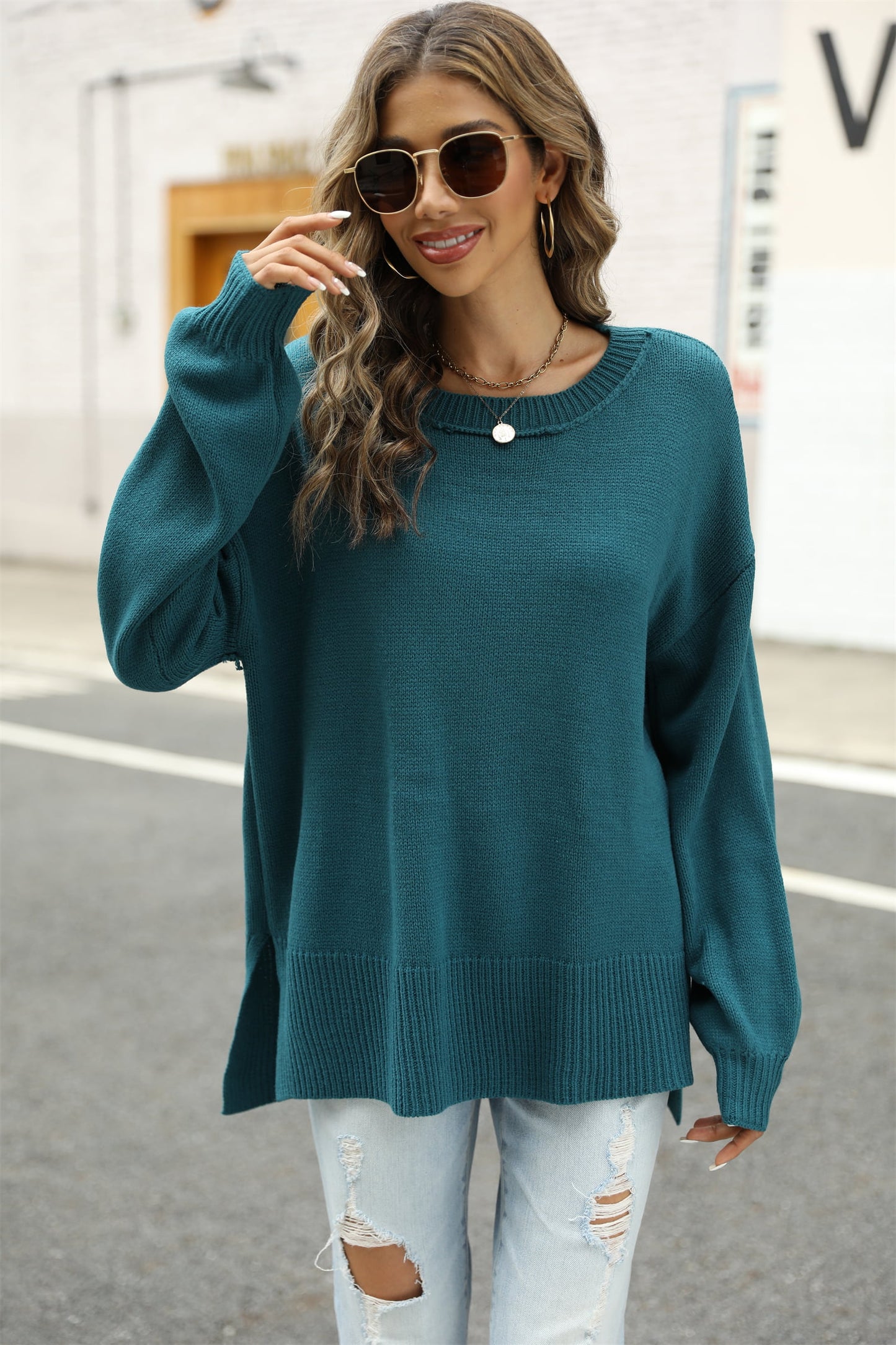 Get trendy with Round Neck Dropped Shoulder Slit Sweater - Sweater available at Styles Code. Grab yours today!