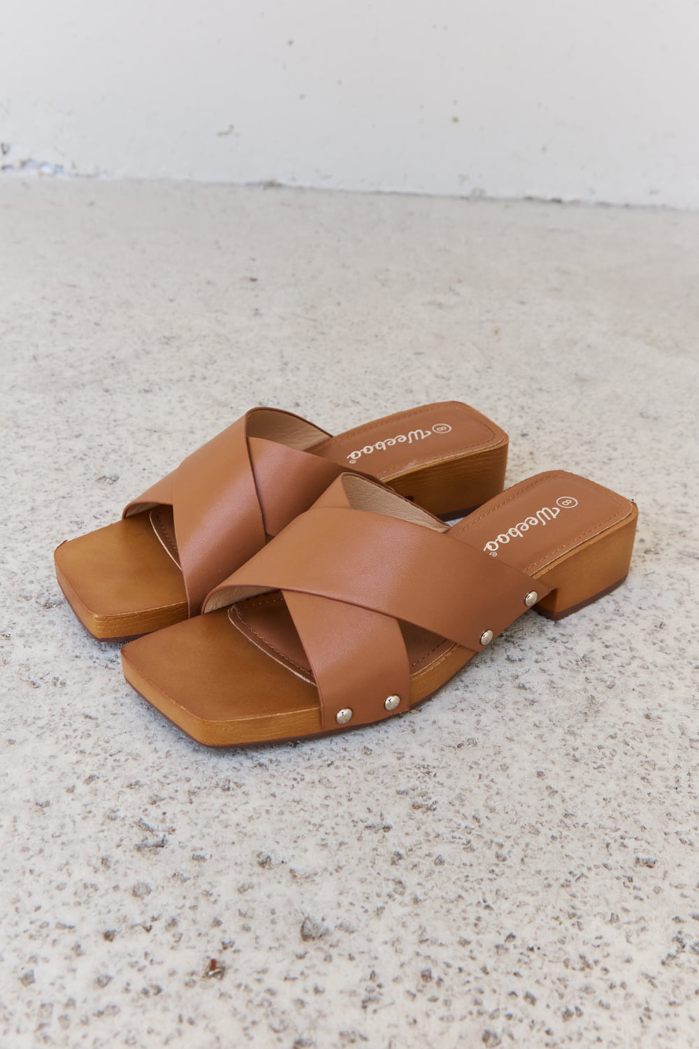 Get trendy with Weeboo Step Into Summer Criss Cross Wooden Clog Mule in Brown - Shoes available at Styles Code. Grab yours today!