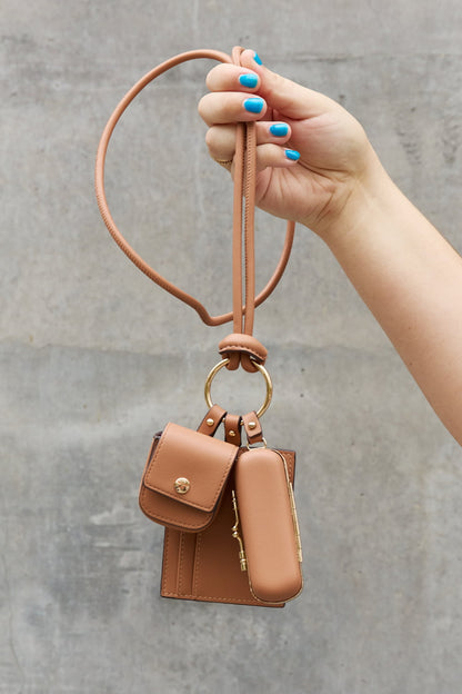 Get trendy with Nicole Lee USA Vegan Leather 3-Piece Lanyard Set - Bags available at Styles Code. Grab yours today!