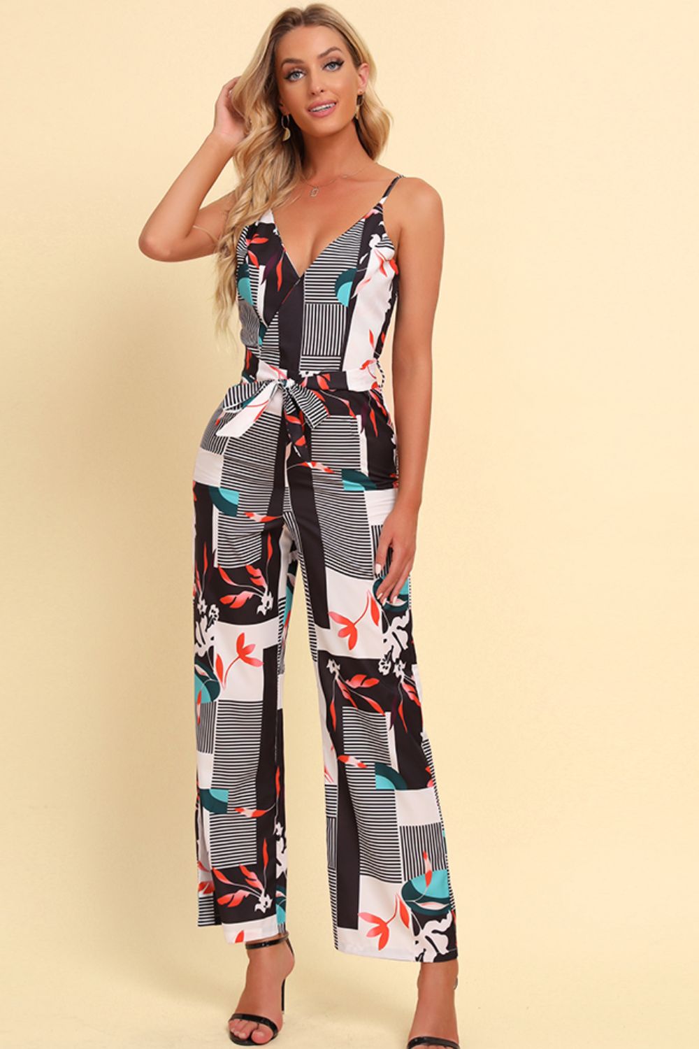 Get trendy with Printed Spaghetti Strap Tied Jumpsuit - Jumpsuits available at Styles Code. Grab yours today!