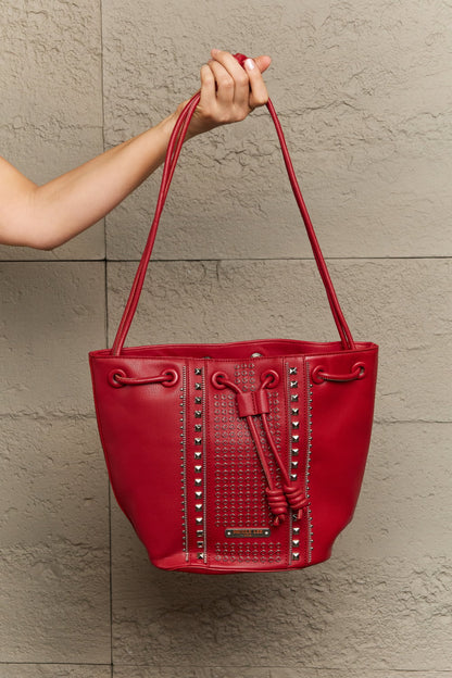 Get trendy with Nicole Lee USA Amy Studded Bucket Bag - Bags available at Styles Code. Grab yours today!