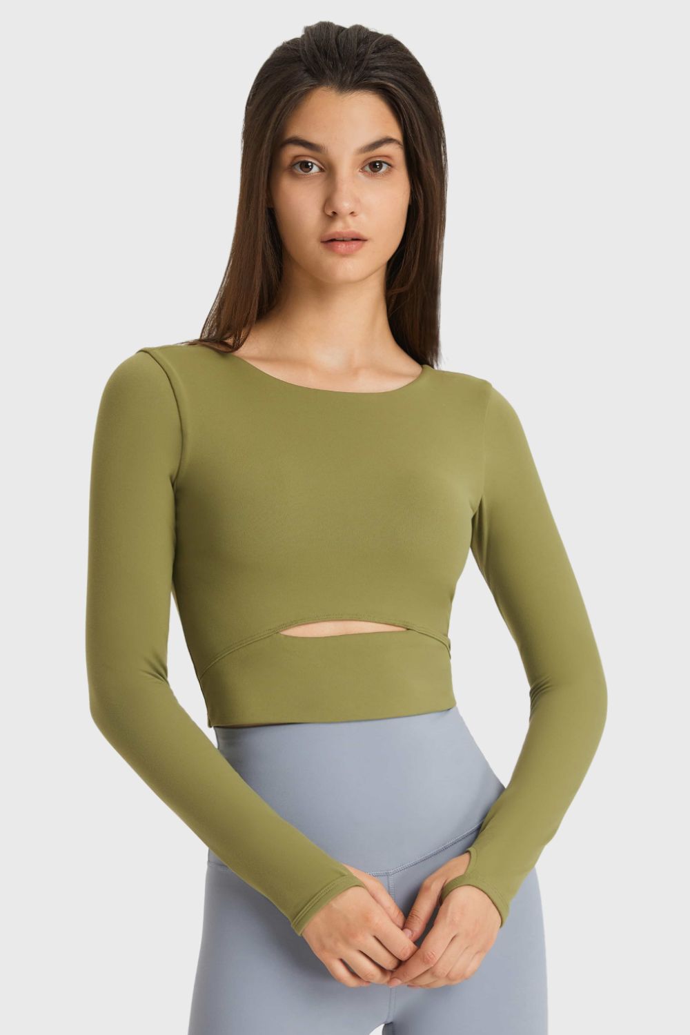 Get trendy with Cutout Long Sleeve Cropped Sports Top - Activewear available at Styles Code. Grab yours today!