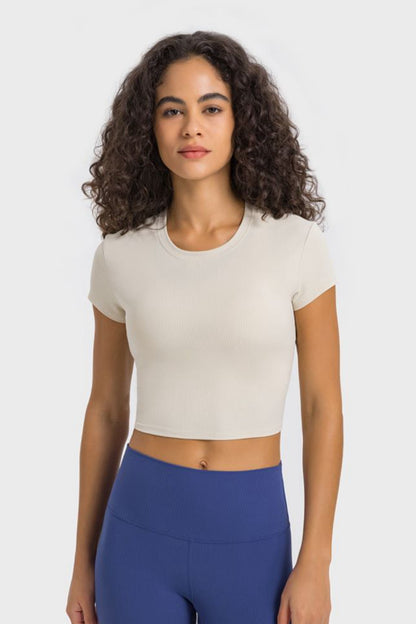 Get trendy with Round Neck Short Sleeve Cropped Sports T-Shirt - Activewear available at Styles Code. Grab yours today!