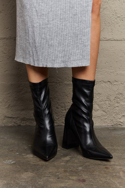 Get trendy with Weeboo Stacy Block Heel Sock Boots - Shoes available at Styles Code. Grab yours today!