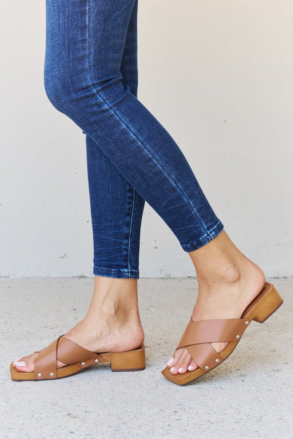 Get trendy with Weeboo Step Into Summer Criss Cross Wooden Clog Mule in Brown - Shoes available at Styles Code. Grab yours today!