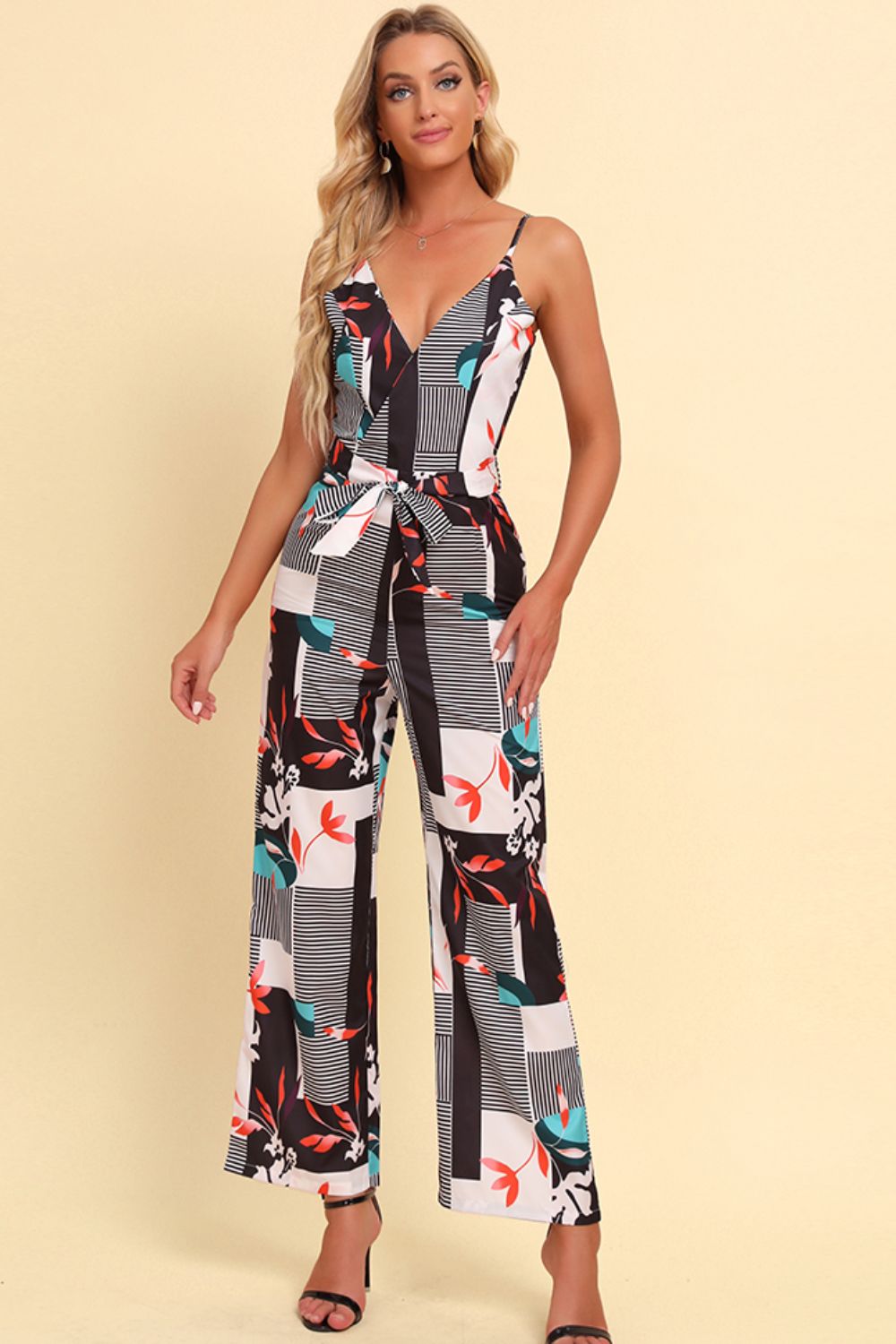 Get trendy with Printed Spaghetti Strap Tied Jumpsuit - Jumpsuits available at Styles Code. Grab yours today!