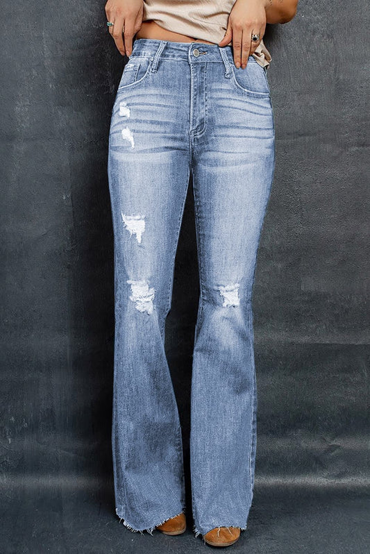 Get trendy with Distressed Raw Hem Flare Jeans - Jeans available at Styles Code. Grab yours today!