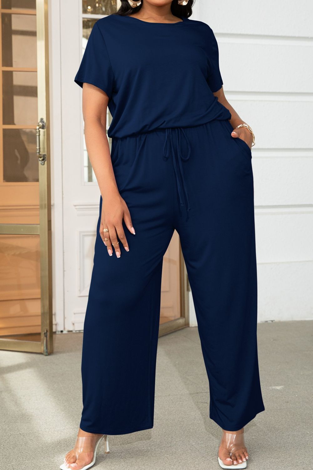 Get trendy with Plus Size Drawstring Waist Short Sleeve Jumpsuit - Plus size available at Styles Code. Grab yours today!