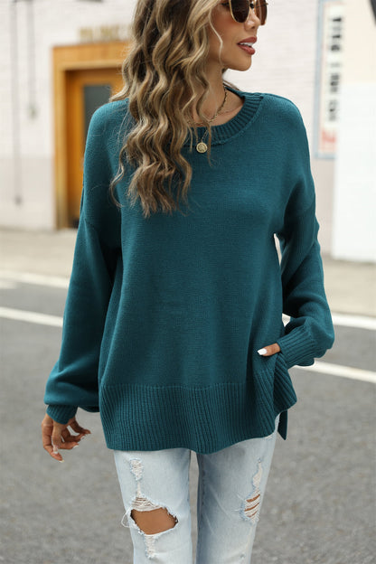 Get trendy with Round Neck Dropped Shoulder Slit Sweater - Sweater available at Styles Code. Grab yours today!