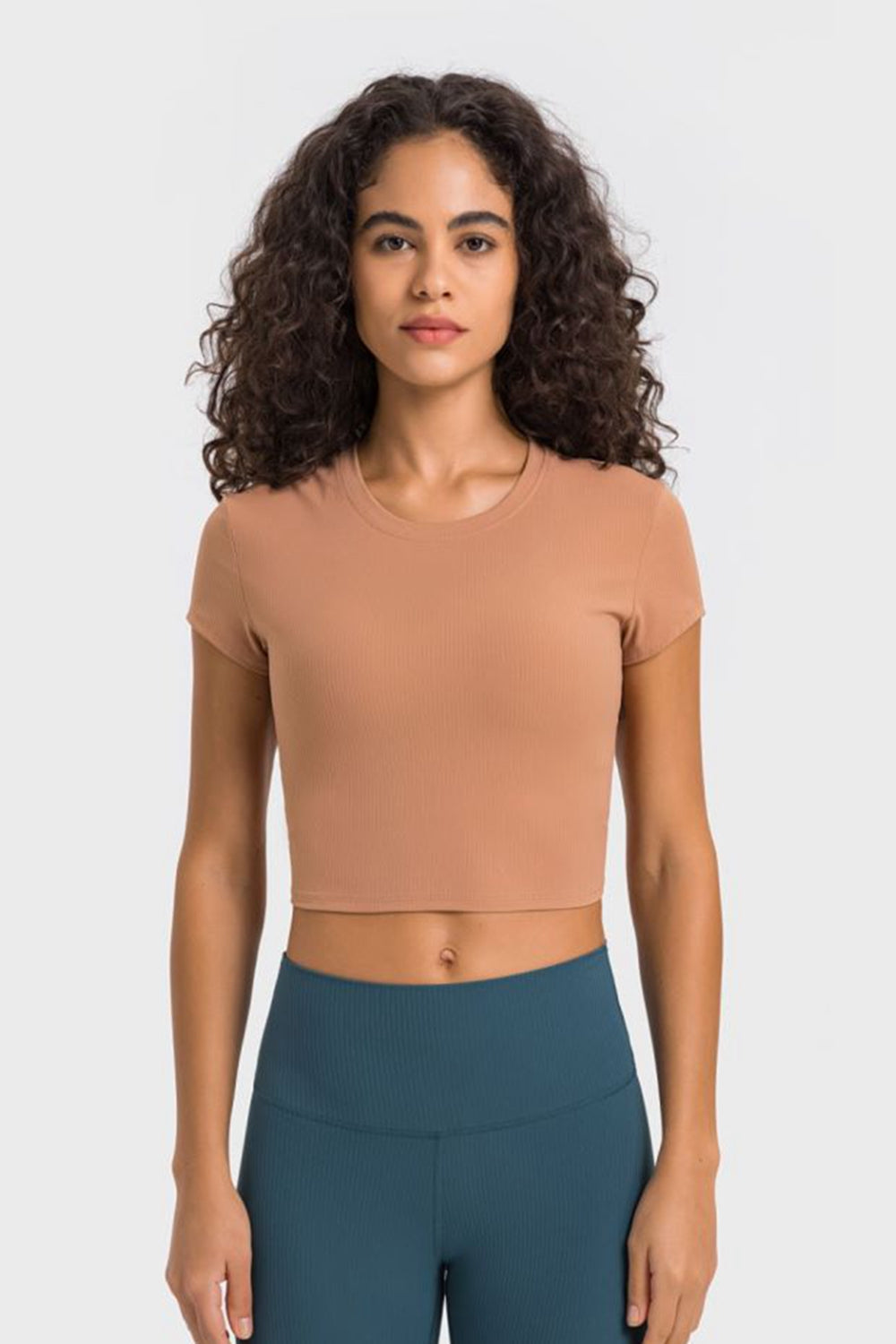 Get trendy with Round Neck Short Sleeve Cropped Sports T-Shirt - Activewear available at Styles Code. Grab yours today!