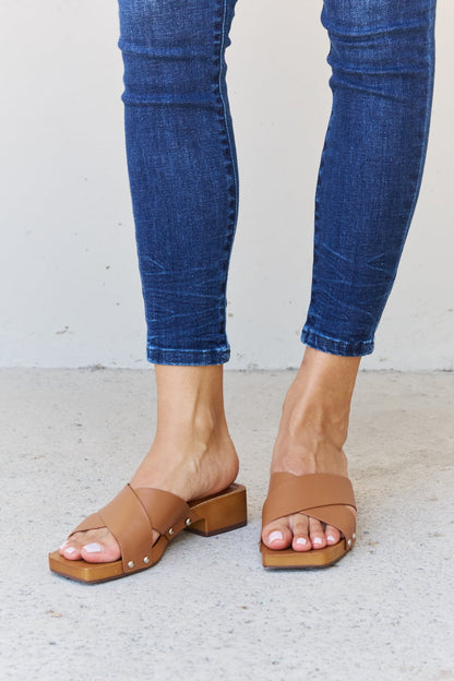 Get trendy with Weeboo Step Into Summer Criss Cross Wooden Clog Mule in Brown - Shoes available at Styles Code. Grab yours today!