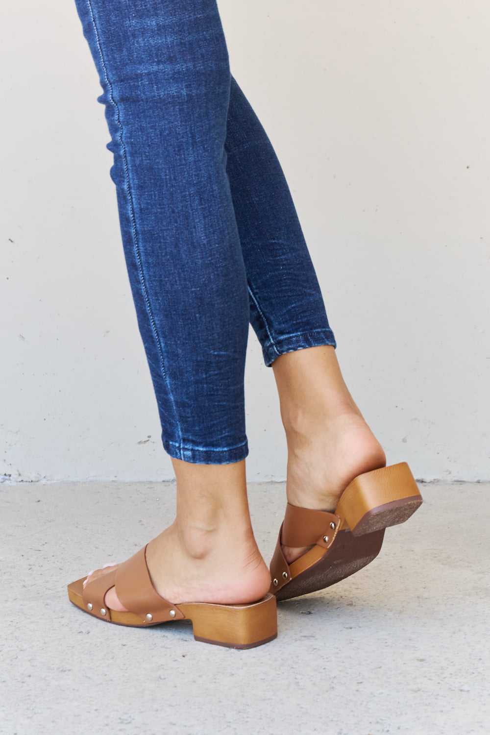 Get trendy with Weeboo Step Into Summer Criss Cross Wooden Clog Mule in Brown - Shoes available at Styles Code. Grab yours today!