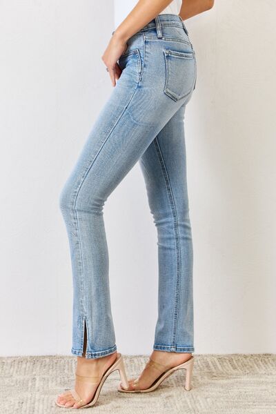 Get trendy with Kancan Full Size Mid Rise Y2K Slit Bootcut Jeans -  available at Styles Code. Grab yours today!